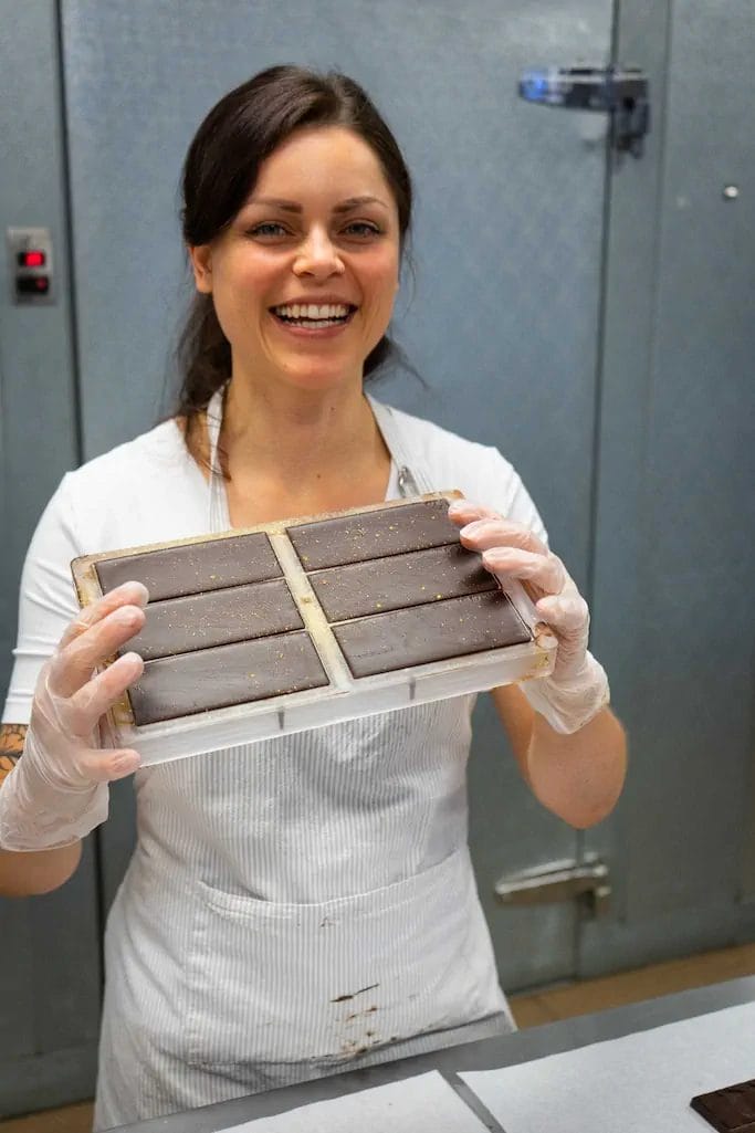 Mara holding chocolate in tray