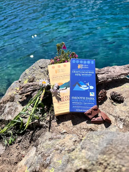 Healthy Chocolate 9 The GOOD Chocolatier Bars on a rock at the edge of a lake